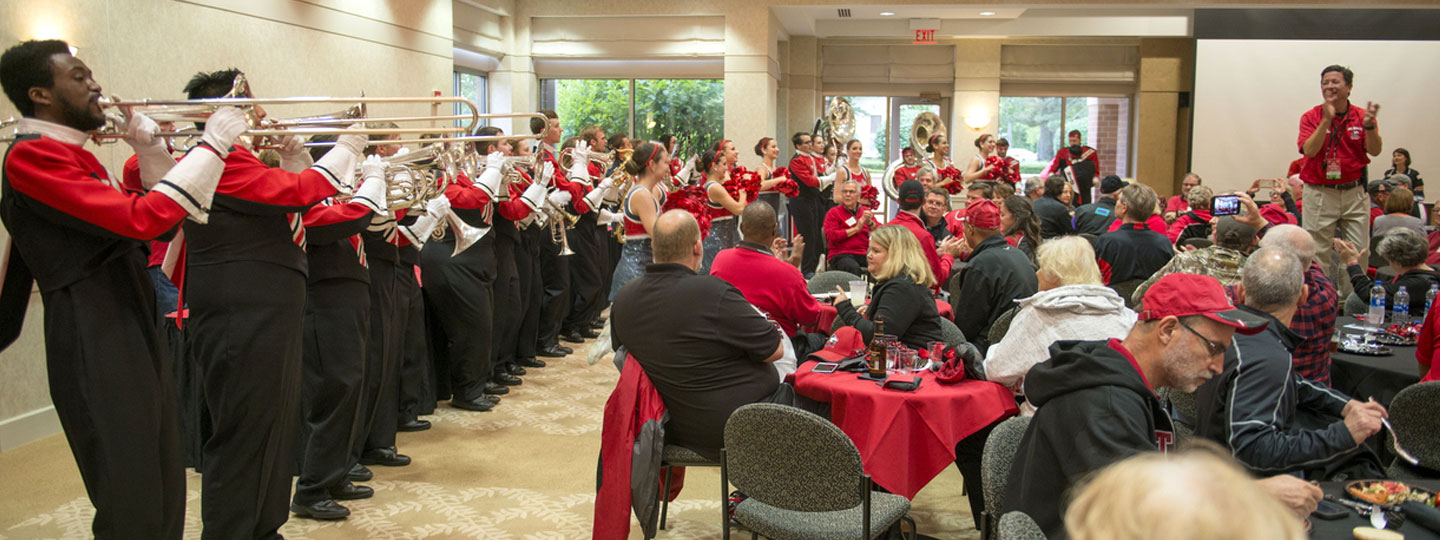 NIU Marching Band entertaining group in BAVC